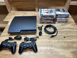 Consola PS3 delgada 160 GB negra CECH-3001A con 2 controladores OEM, cables y 18 juegos - Imagen 1 de 23