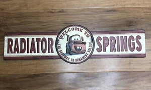 Disney Pixar Cars Land Radiator Springs Racers Embossed Metal Sign - Picture 1 of 3