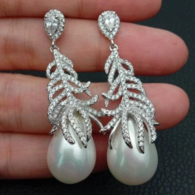 White Sea Shell Pearl Gold Plated Cz Pave Feather Stud Earrings - Image 1 of 4