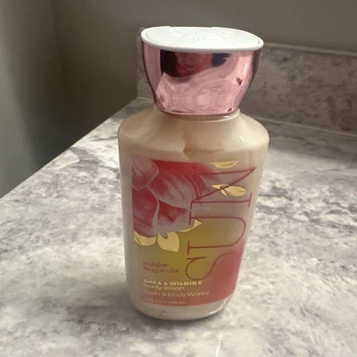 BATH AND BODY WORKS GOLDEN MAGNOLIA LOCIÓN CORPORAL SOLAR 8 FL OZ Foto 1 de 2