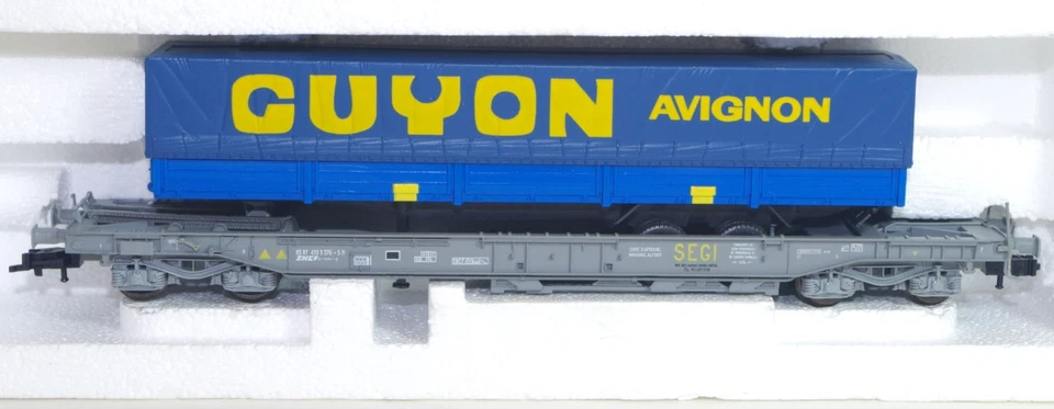 ROCO Réf: 46370 Wagon poche SEGI chargé d'une remorque GUYON en BO (409) - Photo 1/1