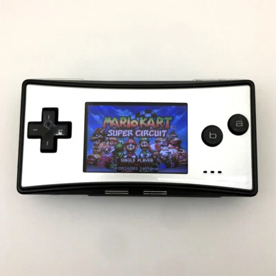Cuerpo negro con placa frontal plateada consola de juegos Nintendo Game Boy Micro GBM usada Foto 1 de 4