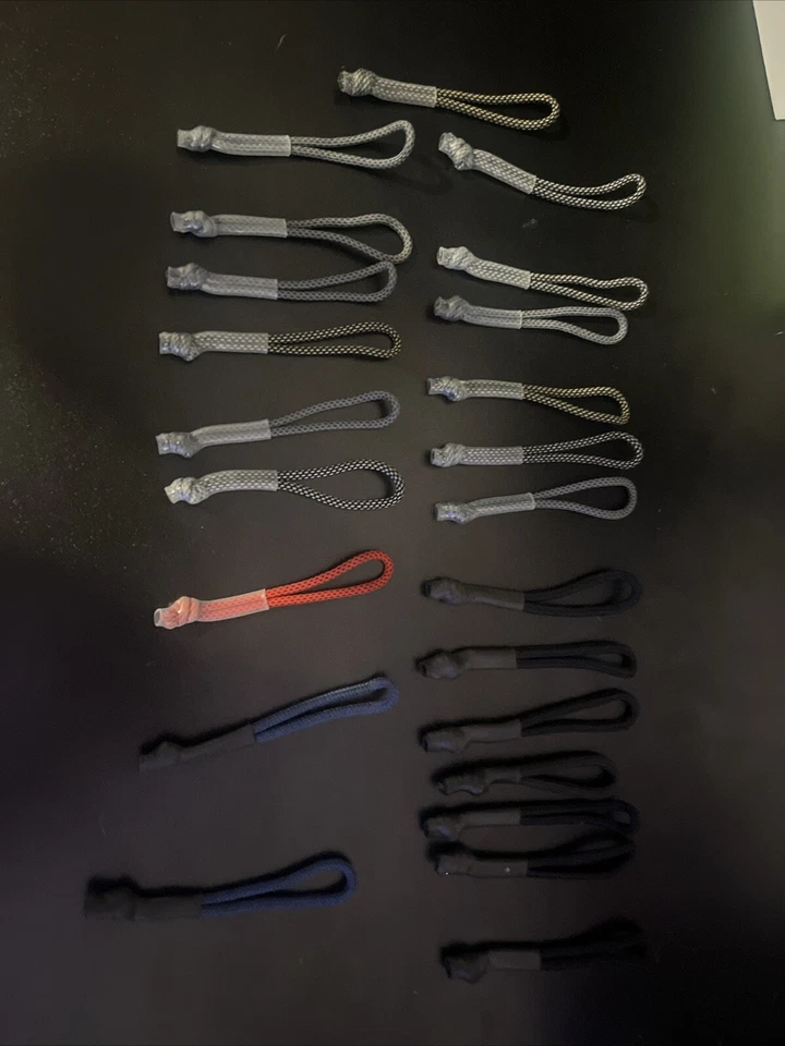 Nike Backpack Zipper Strings.13 Grey, 7 Black, 2 Blues, And 1 Red. 23 Total. - Image 1 of 4