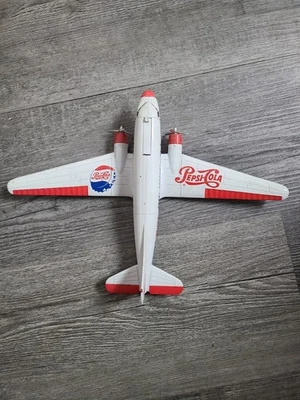 PEPSI-COLA GOLDEN WHEEL DIE CAST GIFT BANK COIN PLANE - Image 1 of 4