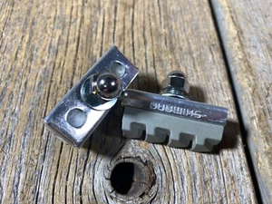 OLD SCHOOL BMX MX SHIMANO BRAKE PADS AND HOLDERS BRAKE PAD & HOLDER NOS PAIR - Picture 1 of 2