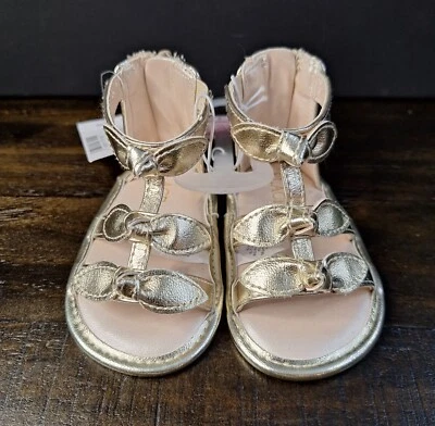 The Children's Place Baby Girl 6-12 Month Metallic Bow Gladiator Sandals - Gold - Image 1 of 4