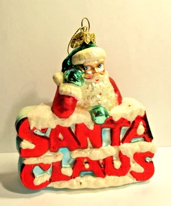 Retired Christopher Radko Santa on Santa Leaning on Sign Glass Ornament 5 1/4" - Picture 1 of 2