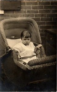 Vintage RPPC Photo Postcard Unhappy Baby in Wicker Baby Carriage AZO - Picture 1 of 3