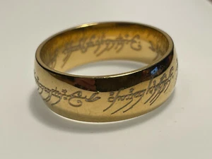 LE SEIGNEUR DES ANNEAUX : BAGUE COULEUR OR NEUVE + POCHETTE - Picture 1 of 5