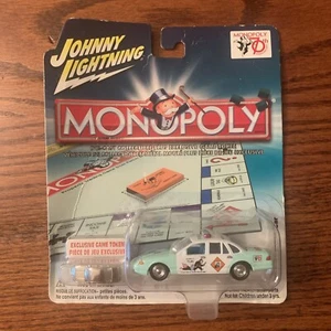JOHNNY LIGHTNING 2005 - MONOPOLY 70TH ANNIVERSARY 1997 FORD POLICE CAR w/ token - Picture 1 of 2
