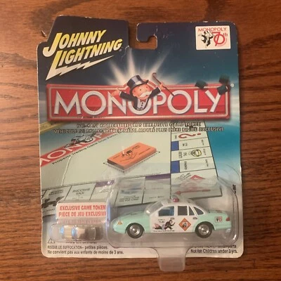 JOHNNY LIGHTNING 2005 - MONOPOLY 70TH ANNIVERSARY 1997 FORD POLICE CAR w/ token - Image 1 of 2