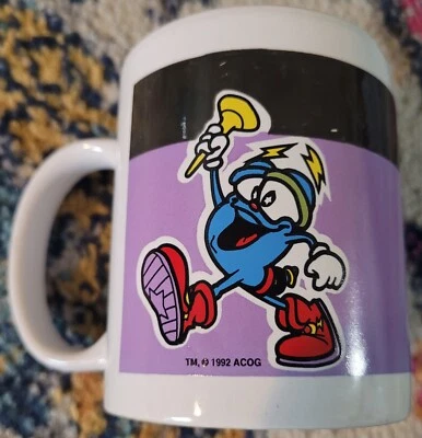 Taza de café de cerámica de los Juegos Olímpicos 1992 - Antorcha de transporte Izzy Mascot ACOG Foto 1 de 4