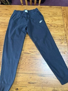 Pantalones deportivos Nike para hombre medianos negros con puños bolsillos de algodón logotipo Swoosh U12 - Imagen 1 de 8