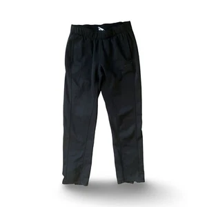 Pantalones deportivos Nike Therma-Fit pequeños negros con bolsillos y cremallera en la pierna - Imagen 1 de 8