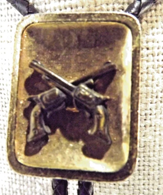 Pistolas de aspecto de cobre vaquero Western Bolo corbata con puntas de cobre cuerda de cuero trenzada Foto 1 de 4