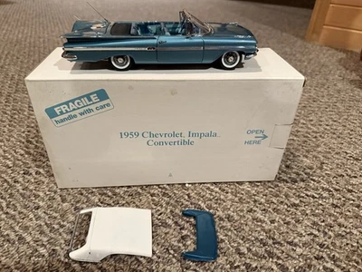 Danbury Mint 1959 Chevrolet Impala Convertible Teal 1:24 - Image 1 of 4
