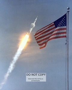 APOLLO 11 AFTER LAUNCH AS IT IS PHOTOGRAPHED BEHIND FLAG - 8X10 PHOTO (AA-170) - Picture 1 of 1