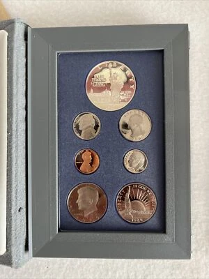 1986 S U.S. MINT PRESTIGE PROOF SET STATUE OF LIBERTY 90% SILVER DOLLAR 7 COINS - Image 1 of 4