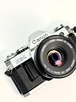 Film Camera Canon AE-1 35mm Vintage SLR  with FD 50mm Lens - Silver [NEW SEALS] - Image 1 of 4