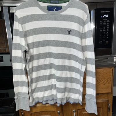 Pullover American Eagle vintage para hombre L gris y blanco roto a rayas manga larga Foto 1 de 4