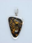 Amber and sterling pendant; pre-owned, beautiful amber; loosely triangle shaped