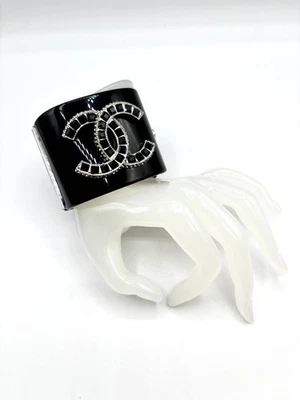Authentic Chanel black resin cuff bracelet with a crystal CC logo - Image 1 of 4
