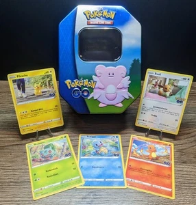 POKEMON - Geschenkset - Tin Box HEITEIRA - zzgl. 5 beliebte Sammelkarten - Bild 1 von 10