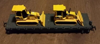 HO scale vintage unmarked flat car with two CAT D5G XL Track Type Tractors - Image 1 of 4