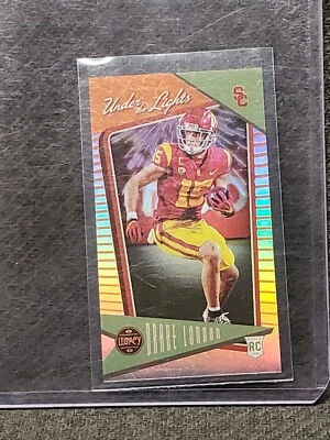 DRAKE LONDON 2022 PANINI LEGACY ORANGE PRIZM UNDER THE LIGHTS /125 RC - Image 1 of 3