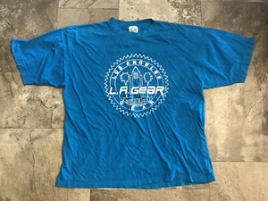 T-shirt vintage turchese LA Gear Los Angeles CA taglia 2 unisex cotone 1269 - Foto 1 di 4