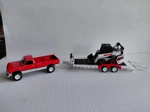 1/64 1991 Dodge Power Ram 250 W Car Hauler with Bobcat S76 Kompaktlader - Bild 1 von 3