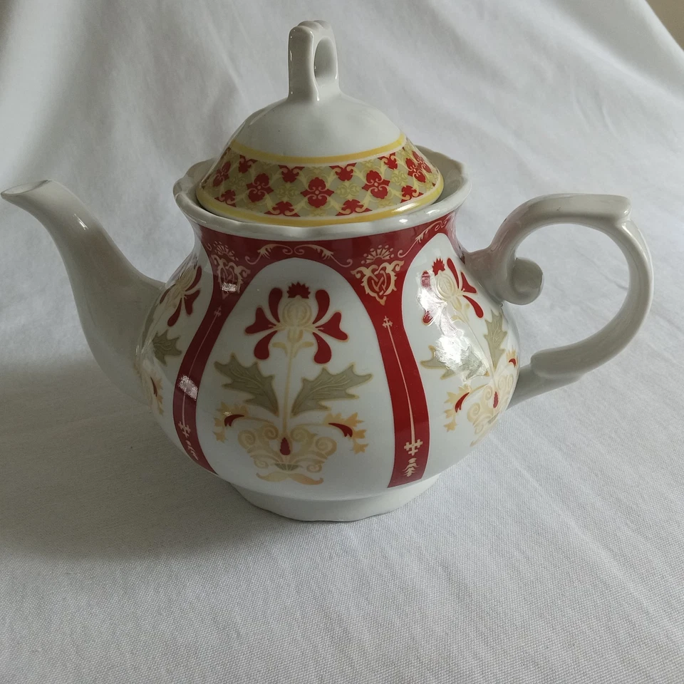 Tetera de diente de león rojo, blanco y dorado Foto 1 de 1