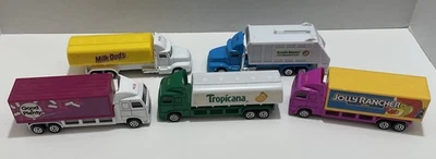1996 Hot Wheels Highway Haulers Candy, Tropicana, Milk Duds, Good&Plenty+Recycle - Image 1 of 4