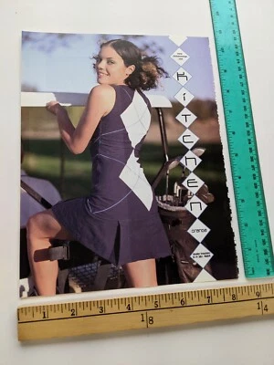 Recorte de 1 página - Bonita mujer argyle vestido corto cocina naranja estampado anuncio 2002 Foto 1 de 2