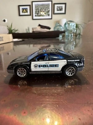 2006 Matchbox #MB71 MBX Metal Series Police Car Black  - Image 1 of 4