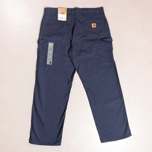 Pantalones de mezclilla de carpintero de lona calce suelto Carhartt azules para hombre 38x31 (B159-NVY) NUEVOS CON ETIQUETAS - Imagen 1 de 6
