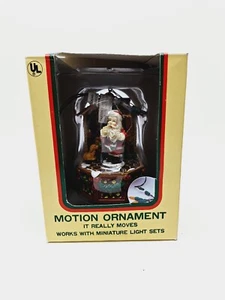 Vintage Spinning Motion Ornament Made by Eluceo Christmas Santa Stocking and Boy - Picture 1 of 4