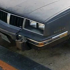 Pontiac 6000, 1982, 1983, izquierda - bisel del faro del conductor Foto 1 de 4