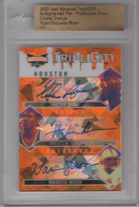 NOLAN RYAN/HAKEEM OLAJUWON/MOON 2022 LEAF VIBRANCE CRYSTAL ORANGE PROOF AUTO 1/1 - Bild 1 von 2