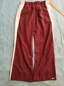 Pantalones Nike para mujer medianos rojos borgoña con rayas rosas atléticos gimnasio entrenamiento - Imagen 1 de 9