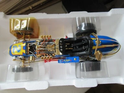 AL UNSER PARNELLI JONES SIGNED GOLD JOHNNY LIGHTNING 4 CAM FORD DIRT CHAMP 1:12 - Image 1 of 4