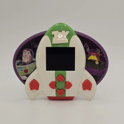 Toy Story LCD Juego Portátil Buzz Lightyear vs Zurg Rocket Ship Vintage Retro Foto 1 de 4