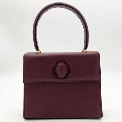 Mini bolso de mano Cartier Must Line Turnlock de cuero burdeos para mujer de Japón Foto 1 de 4