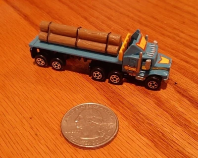 Vintage *Micro Machines* Log Hauler Blue Yellow Semi Truck Flat Bed Lumber Jacks - Image 1 of 4