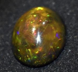 Opale etiope nero naturale 11,40 ct 100% ovale Welo fuoco cabochon pietra preziosa sciolta - Foto 1 di 4