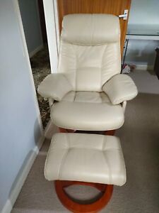 Reclining cream leather recliner chair and matching  foot stool