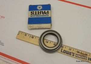 NOS Mopar 1957-1965 REAR AXLE 1-3/8" PINION SEAL W/ 8 3/4 741 case pn 1738831 - Picture 1 of 2