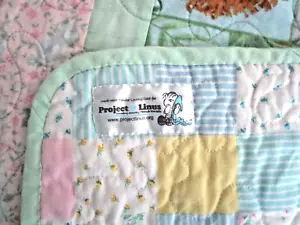 Trapunta Project Linus bambino animali-floreale pastello patchwork cucita a macchina 38"x45" - Foto 1 di 7