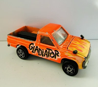 Camioneta pickup Majorette Toyota 4x4 naranja con llamas diecast capó abre "Gladiador" Foto 1 de 4