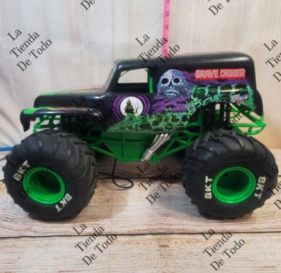 GRAVE DIGGER REMOTE CONTROL FOR PARTS OR REPAIR BKT TIRES - Image 1 of 4